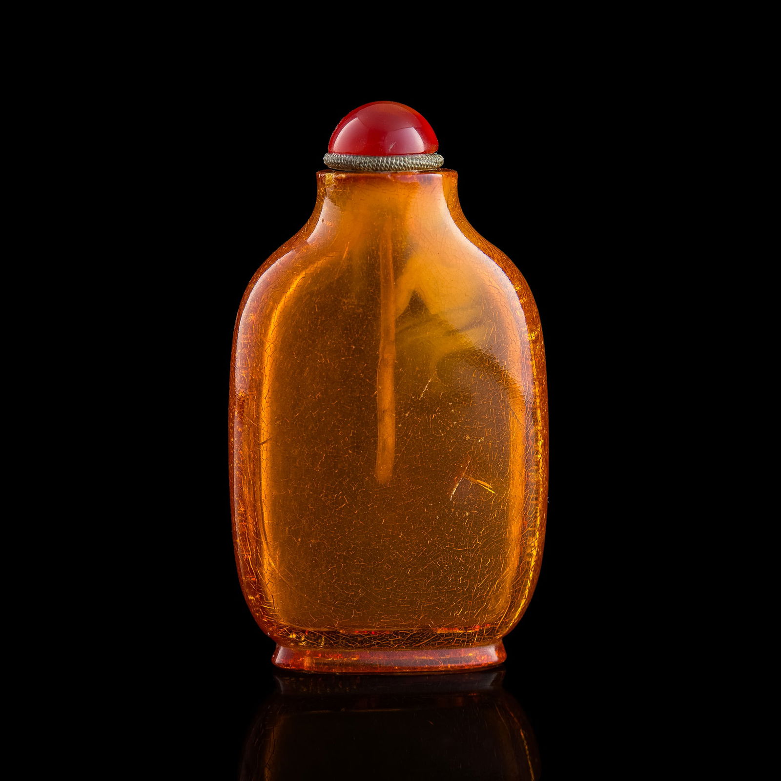 A Chinese carved amber snuff bottle, 19th century (1 of 7)