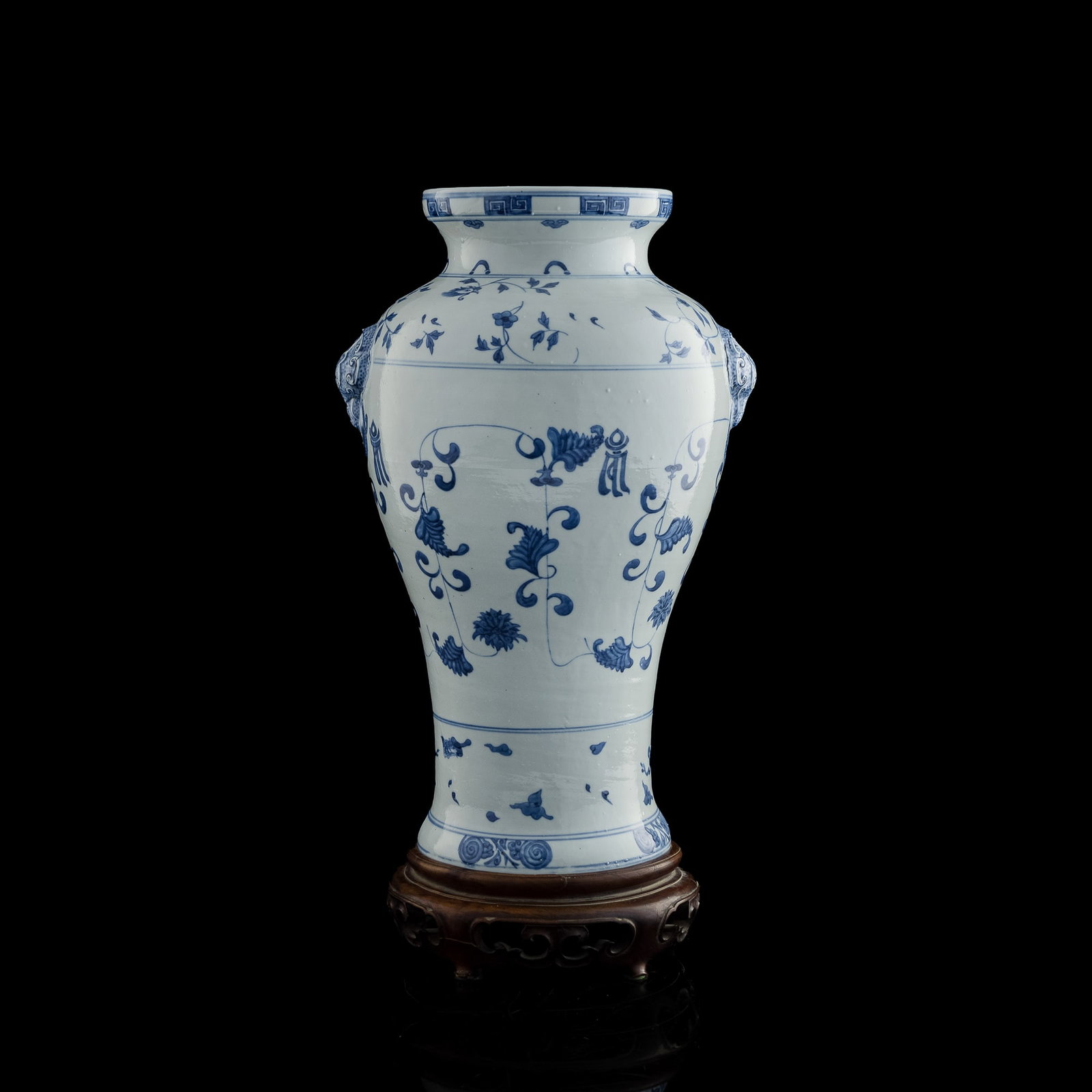 A Chinese blue and white 'floral' vase, Yongzheng period, Qing dynasty: A Chinese blue and white 'floral' vase Yongzheng period, Qing dynasty The simplistic blue and white vase recalls the early Ming examples of the style, with six registers of various geometric meanders 