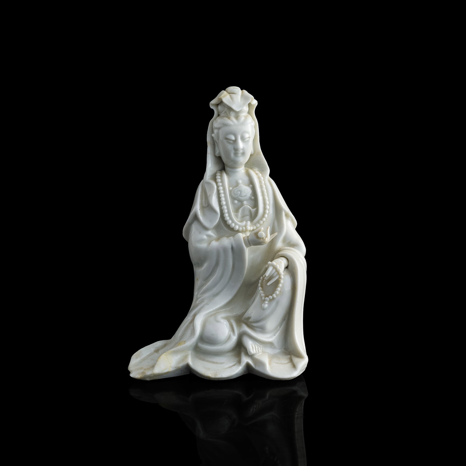 A Chinese Dehua Guanyin figure, 18th century: A Chinese Dehua Guanyin figure 18th century H: 7 1/4, W: 4 3/4, D: 3 1/4 in. (H: 18.42, W: 12.07, D: 8.26 cm.) Provenance: Private collection, Diamond Bar, California.
