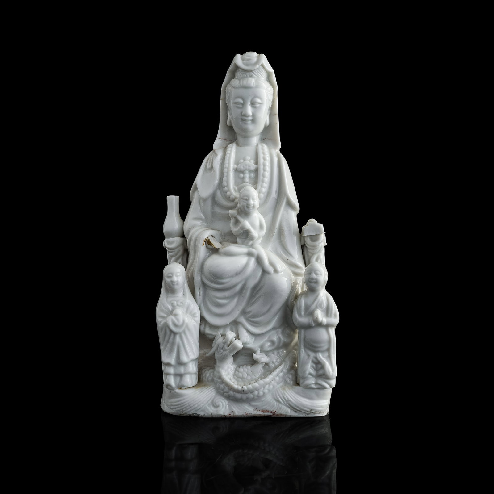 A Chinese Dehua Guanyin figure, 18th century: A Chinese Dehua Guanyin figure 18th century H: 8 3/4, W: 4 1/2, D: 2 1/4 in. (H: 22.23, W: 11.43, D: 5.72 cm.) Provenance: Private collection, Diamond Bar, California.