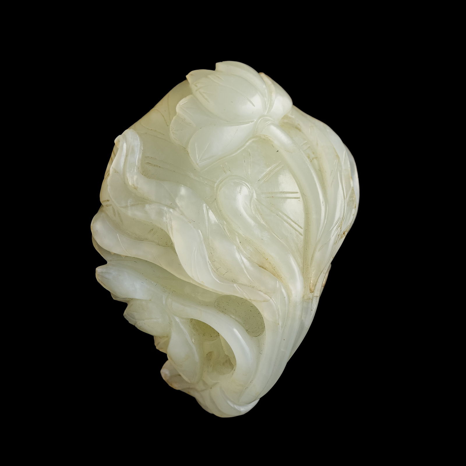 A Chinese carved jade 'lotus pod' pendant, 19th century (1 of 5)