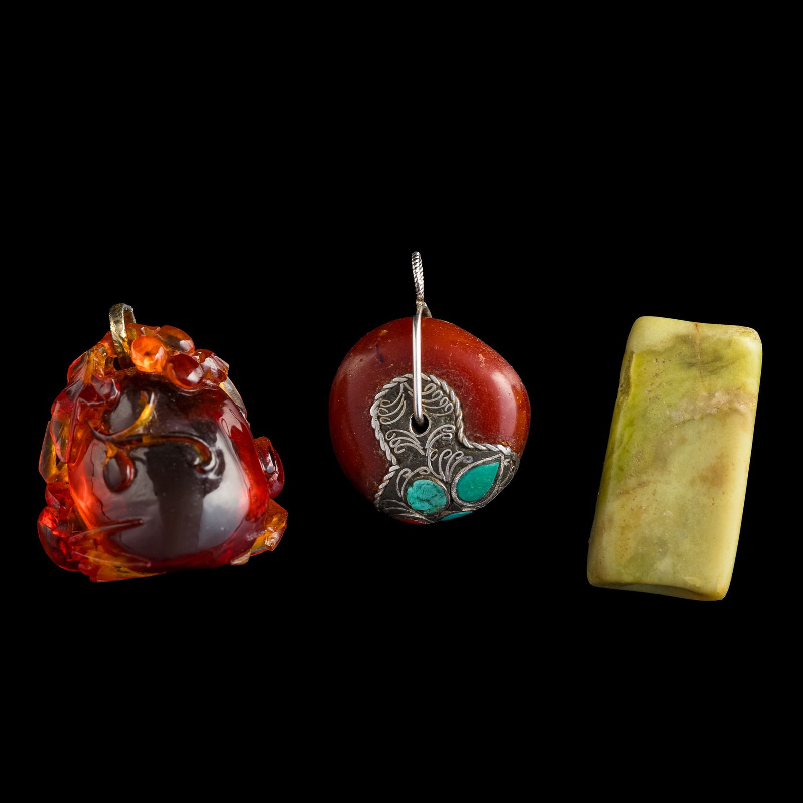 Three Chinese amber and jade toggles, 19th century or later (1 of 7)