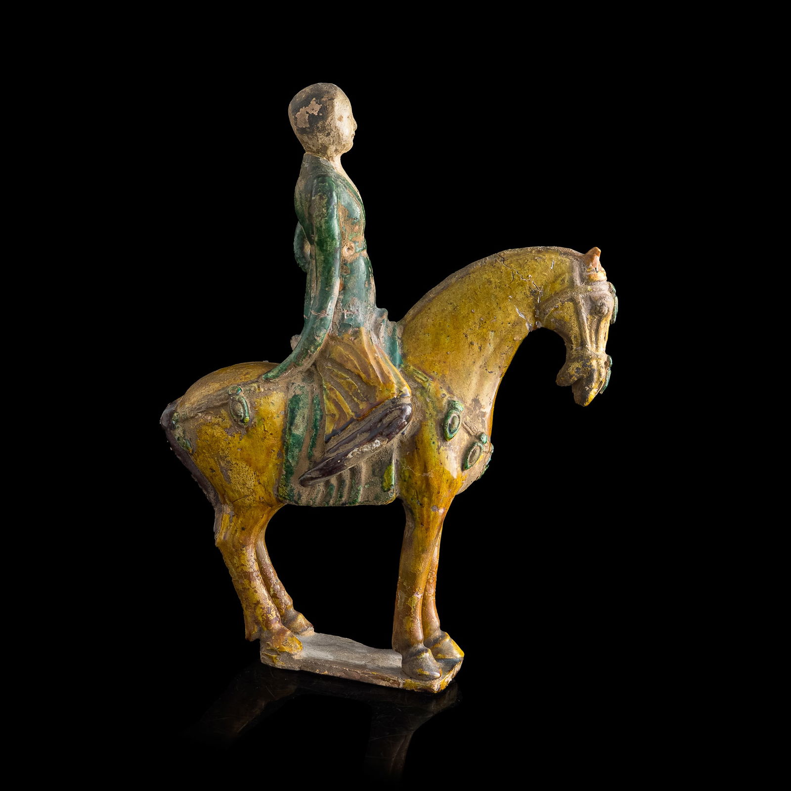 A Chinese sancai-glazed equestrian pottery figure, Tang dynasty (1 of 9)