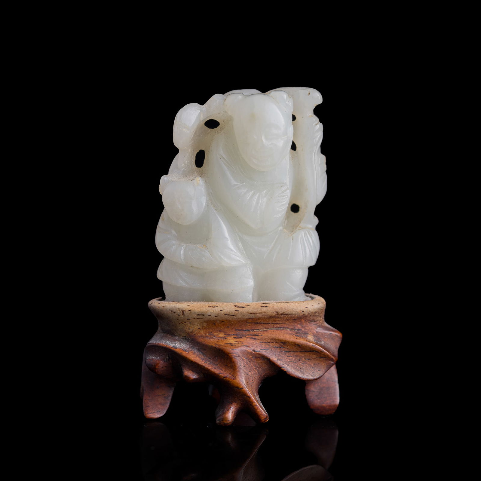 A Chinese carved white jade 'boy' figure, 19th century (1 of 7)