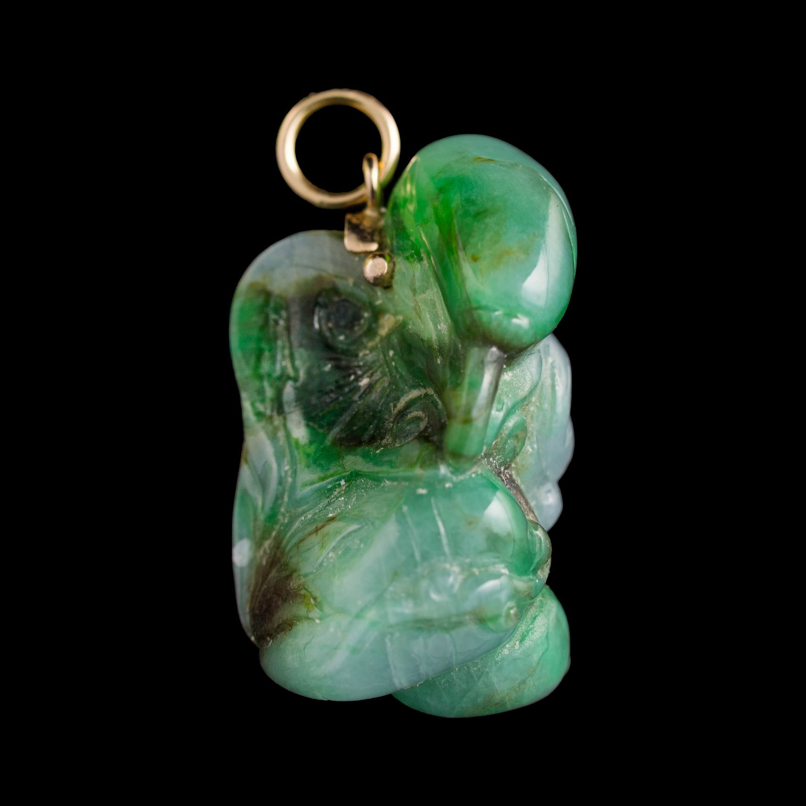 A Chinese jadeite 'lingzhi' and 'ruyi' toggle: A Chinese jadeite 'lingzhi' and 'ruyi' toggle With attached gilt-metal jewelry bail. H: 1 1/8, W: 5/8, D: 1/2 in. (H: 2.86, W: 1.59, D: 1.27 cm. (jadeite)) Provenance: From Mrs. Chiu, San Francisco, C