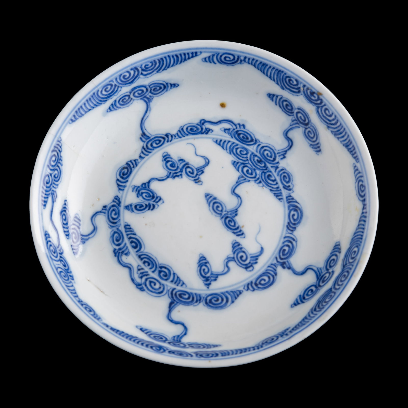 A Chinese blue and white 'cloud' plate, Guangxu period, Qing dynasty: A Chinese blue and white 'cloud' plate Guangxu period, Qing dynasty With six-character Guangxu mark to underside. H: 1 1/8, Dia: 5 5/8 in. (H: 2.86, Dia: 14.29 cm.) Provenance: Private collection, Lau