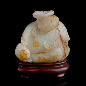 A Chinese carved white jade pomegranate, 18th century