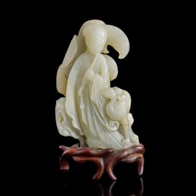 A Chinese carved jade court lady and crane, Ming dynasty