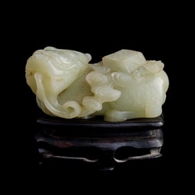 A Chinese carved white jade qilin, 18th century