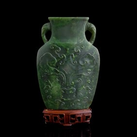 A Chinese carved spinach jade vase with 'elephant-trunk' handles, 18th century