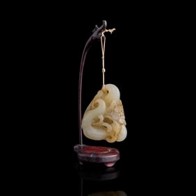 A Chinese carved white jade 'water caltrop' toggle, 19th century