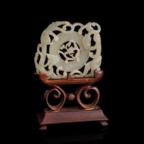 A Chinese carved white jade 'chilong' plaque, Ming dynasty