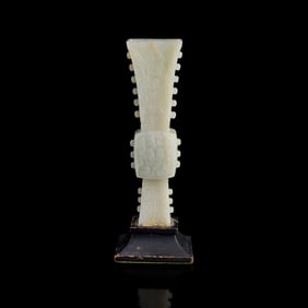 A Chinese carved white jade gu vase, 18th century