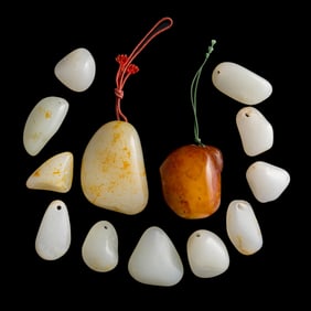 Thirteen pieces of Chinese natural jade stones, 18th/19th century