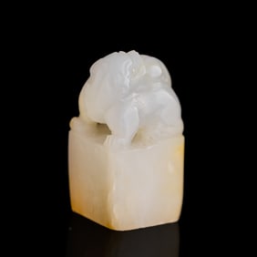 A Chinese white jade seal with russet inclusions, 19th century