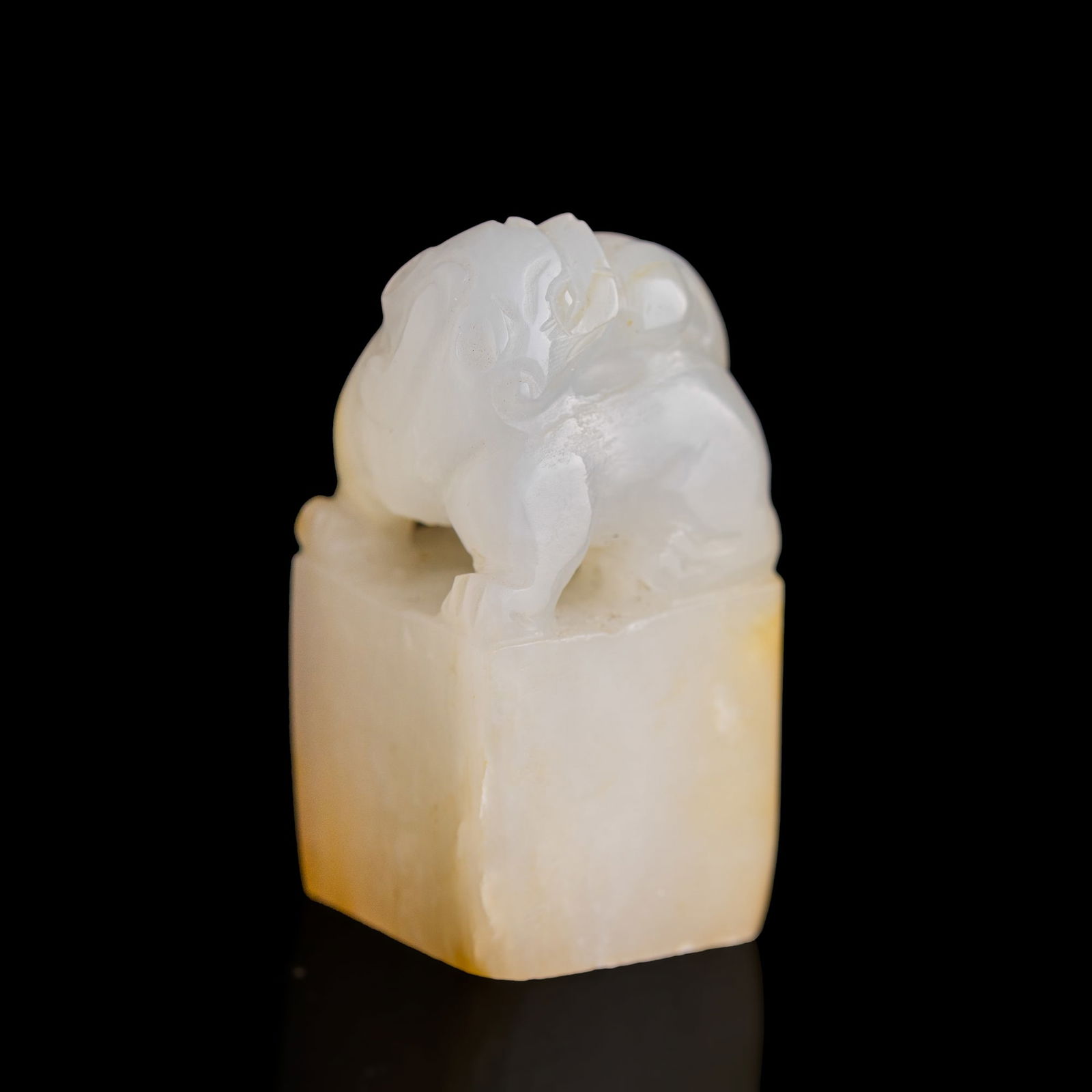A Chinese white jade seal with russet inclusions, 19th century (1 of 8)