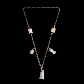 A Chinese silver chain necklace with white jade carvings, Qing dynasty