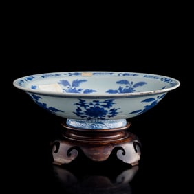 A Chinese blue and white 'scrolling flower' bowl, Qing dynasty