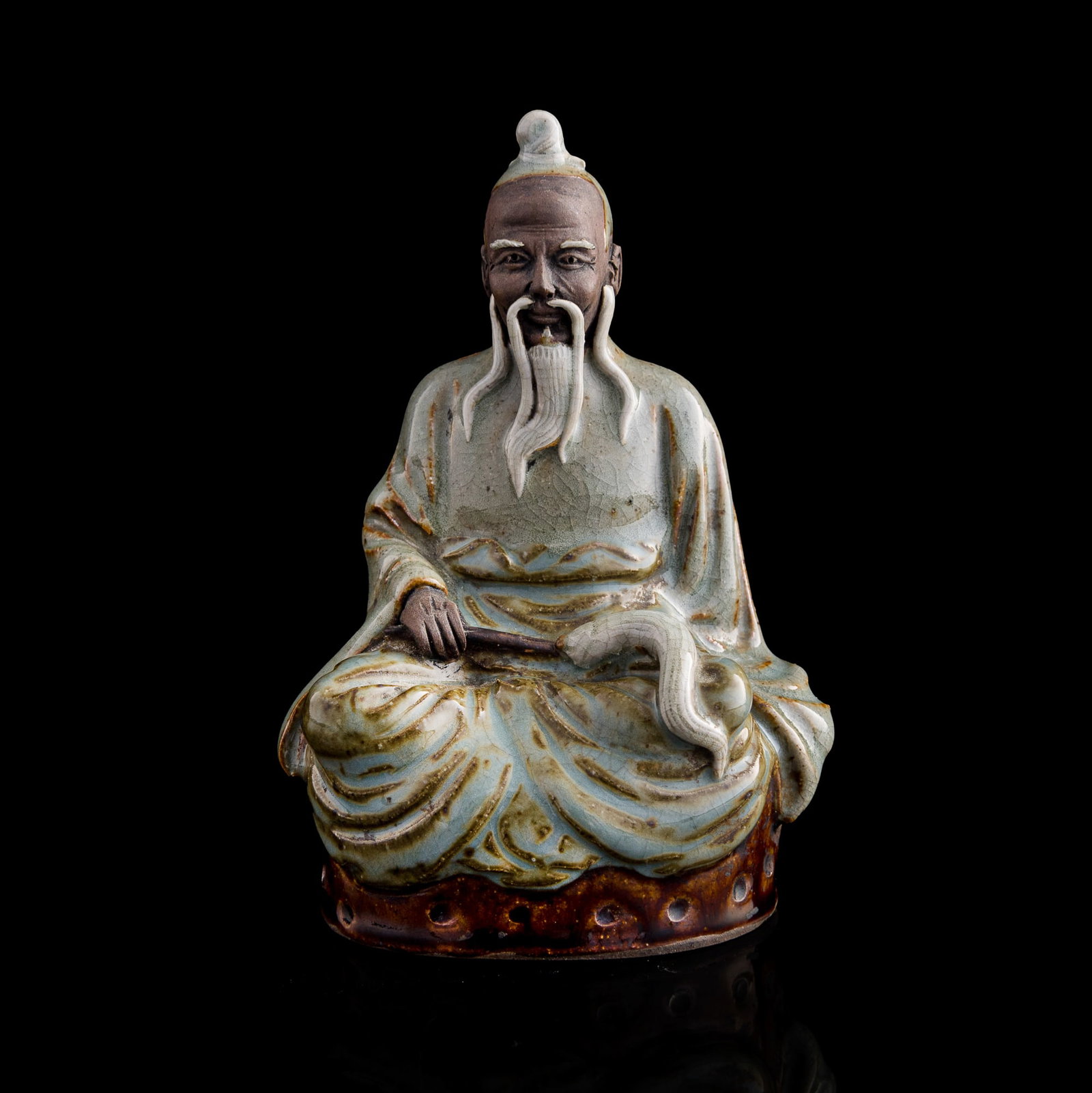 A Chinese Shiwan-kiln Daoist figure, by Liu Hengxin: A Chinese Shiwan-kiln Daoist figure by Liu Hengxin With maker's mark to interior. H: 6 1/4, W: 3 3/4, D: 3 in. (H: 15.88, W: 9.53, D: 7.62 cm.) From the collection of Dr. Lee in Honolulu, Hawaii.