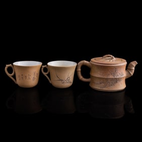 A Chinese zisha bamboo-shaped teapot and two cups, by Jiang Anqing (Chinese, 1886-1953), 19th