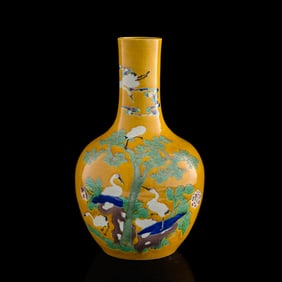 A Chinese yellow-ground sancai 'pine and crane' tianqiu vase, late 19th century