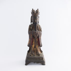 A Chinese gilt-lacquer bronze Taoist god, Ming dynasty