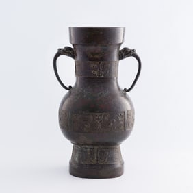 A Chinese bronze double-beast-handle vase, Ming dynasty