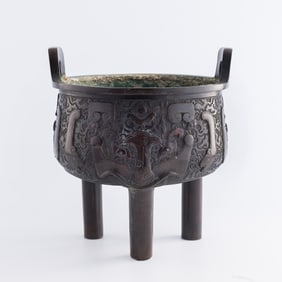 A Chinese silver-inlaid bronze 'taotie' censer, 19th century