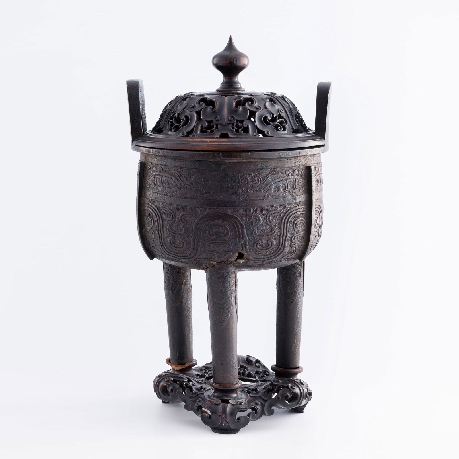 A Chinese bronze 'taotie' ding-form censer, Ming dynasty (1 of 9)