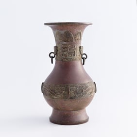 A Chinese bronze 'taotie' double-handle vase, 18th century
