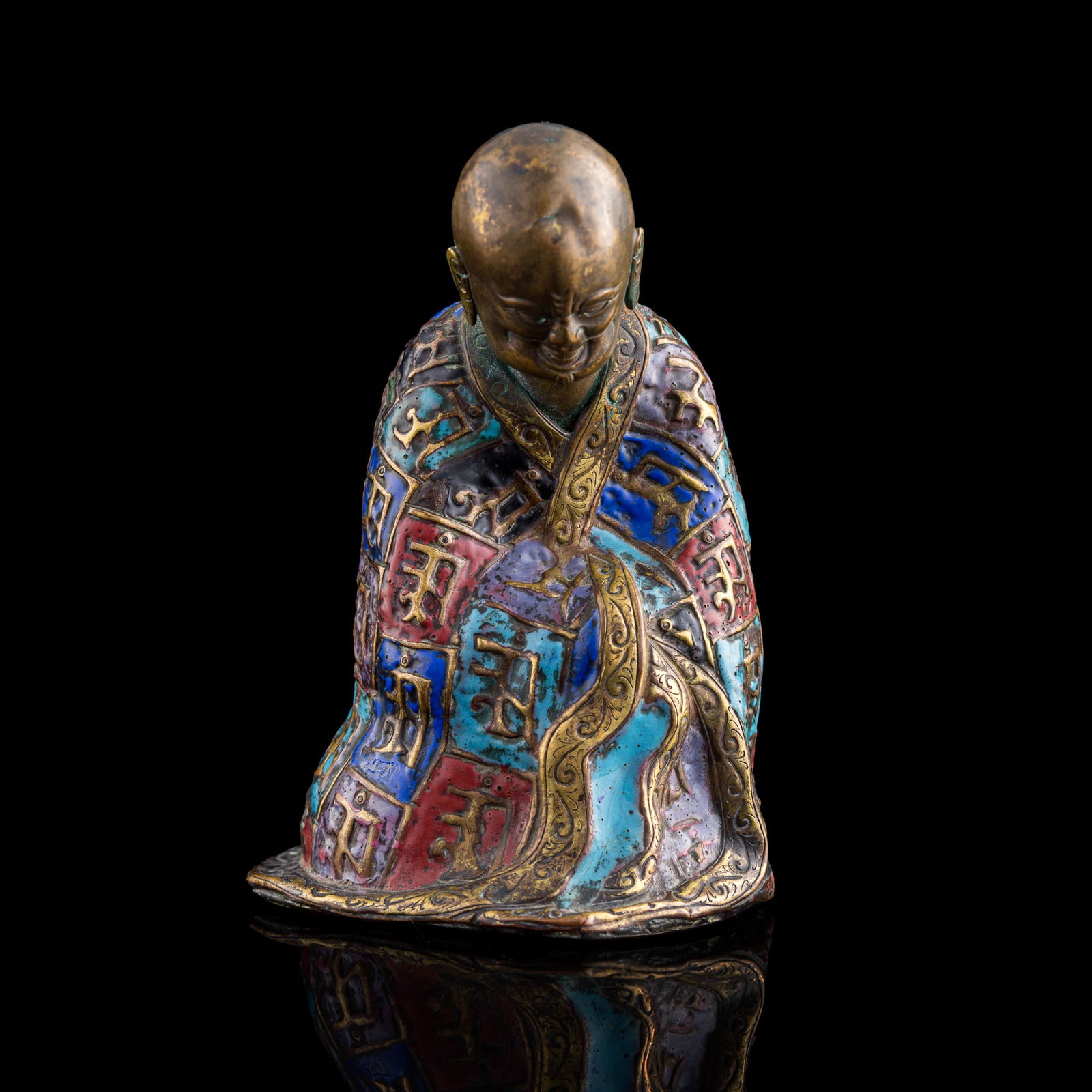 A Chinese gilt-bronze champlevé enamel Luohan, early 19th century (1 of 8)