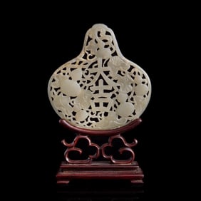 A Chinese pierced white jade 'da ji' plaque, 18th century
