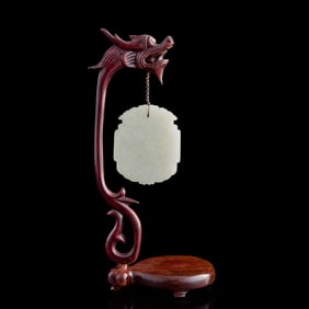 A Chinese white jade plaque, early 19th century
