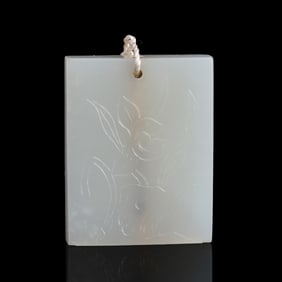 A Chinese white jade 'lotus flower' plaque, 18th/19th century