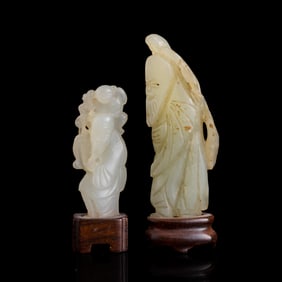 Two Chinese carved white jade scholars, 18th/19th century