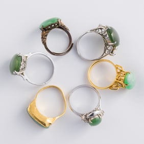 Three Chinese spinach jade and three jadeite rings