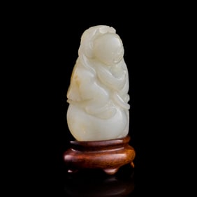 A Chinese white jade boy, early 19th century
