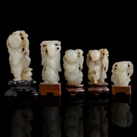Five Chinese carved white jade boys, 18th/19th century