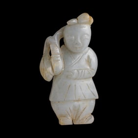 A Chinese carved jade boy, 19th century