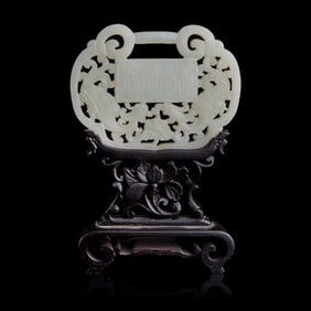 A Chinese pierced white jade lock plate, 19th century