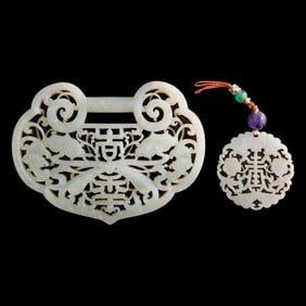 A Chinese white jade reticulated lockplate and round plaque, early 19th century