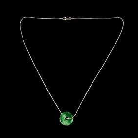 A Chinese jadeite bi disc on fourteen karat white gold necklace chain
