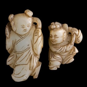 Two Chinese carved jade boys, 18th/19th century
