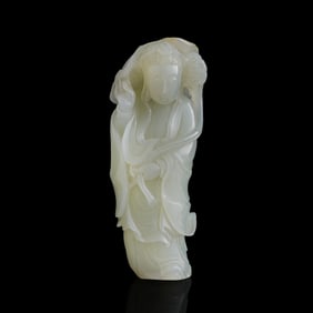 A Chinese white jade carving of Guanyin