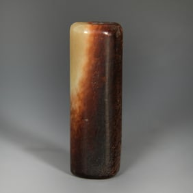 A Chinese cylindrical jade toggle, Ming dynasty or earlier