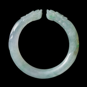 A Chinese 'double dragon' jadeite bangle, 19th century