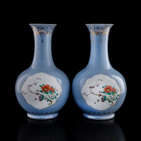 A pair of Chinese blue-ground famille rose vases, Republic period
