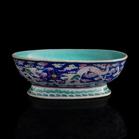 A Chinese blue-ground famille rose fruit bowl, Tongzhi period, Qing dynasty