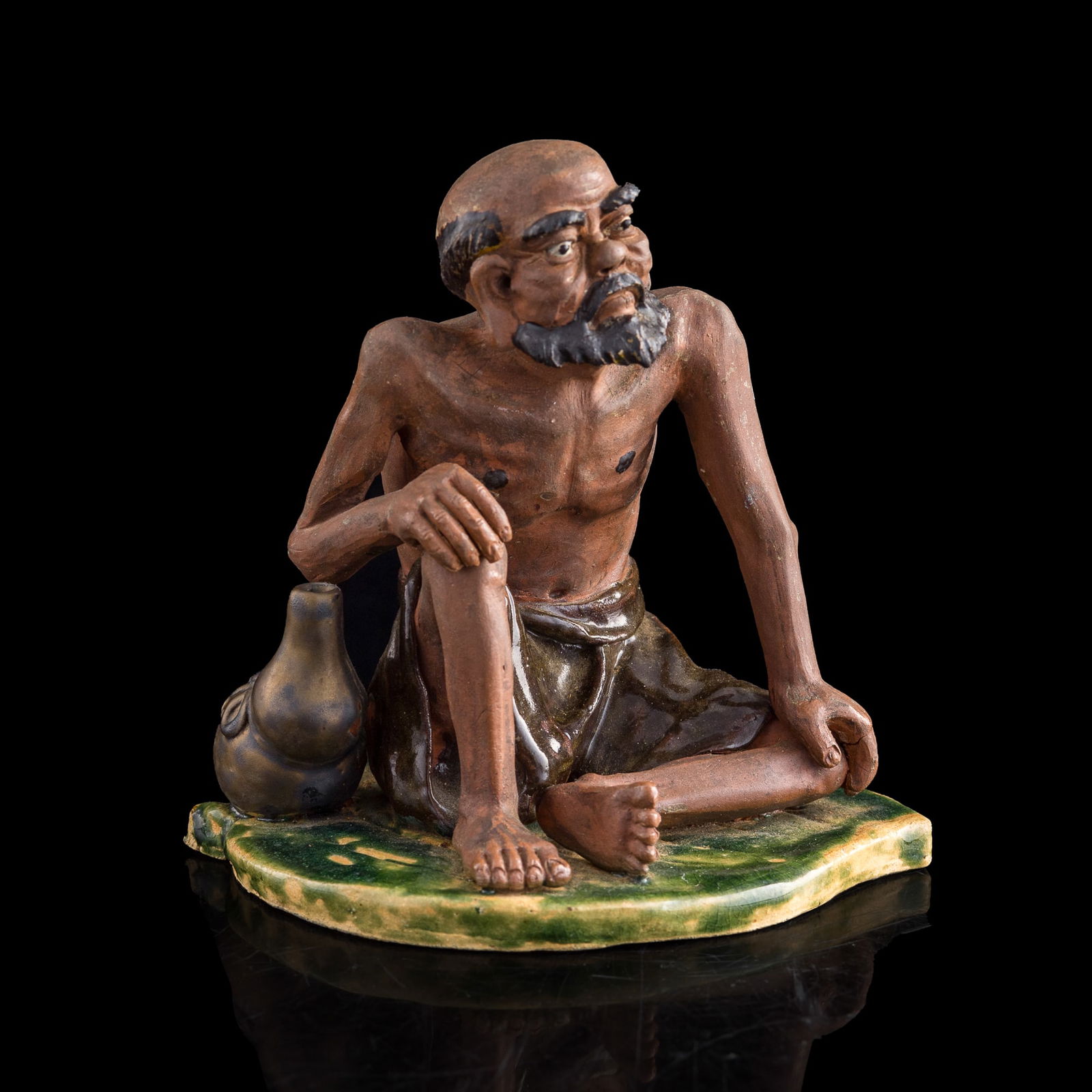 A Chinese Shiwan statue of Damo, Republic period: A Chinese Shiwan statue of Damo Republic period H: 6 3/4, W: 7, D: 5 7/8 in. (H: 17.15, W: 17.78, D: 14.92 cm.) From Mrs. Ng in Houston, Texas, her father acquired these items in Hong Kong prior to th