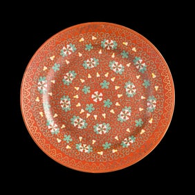 A Chinese coral-ground famille rose plate, late 19th century